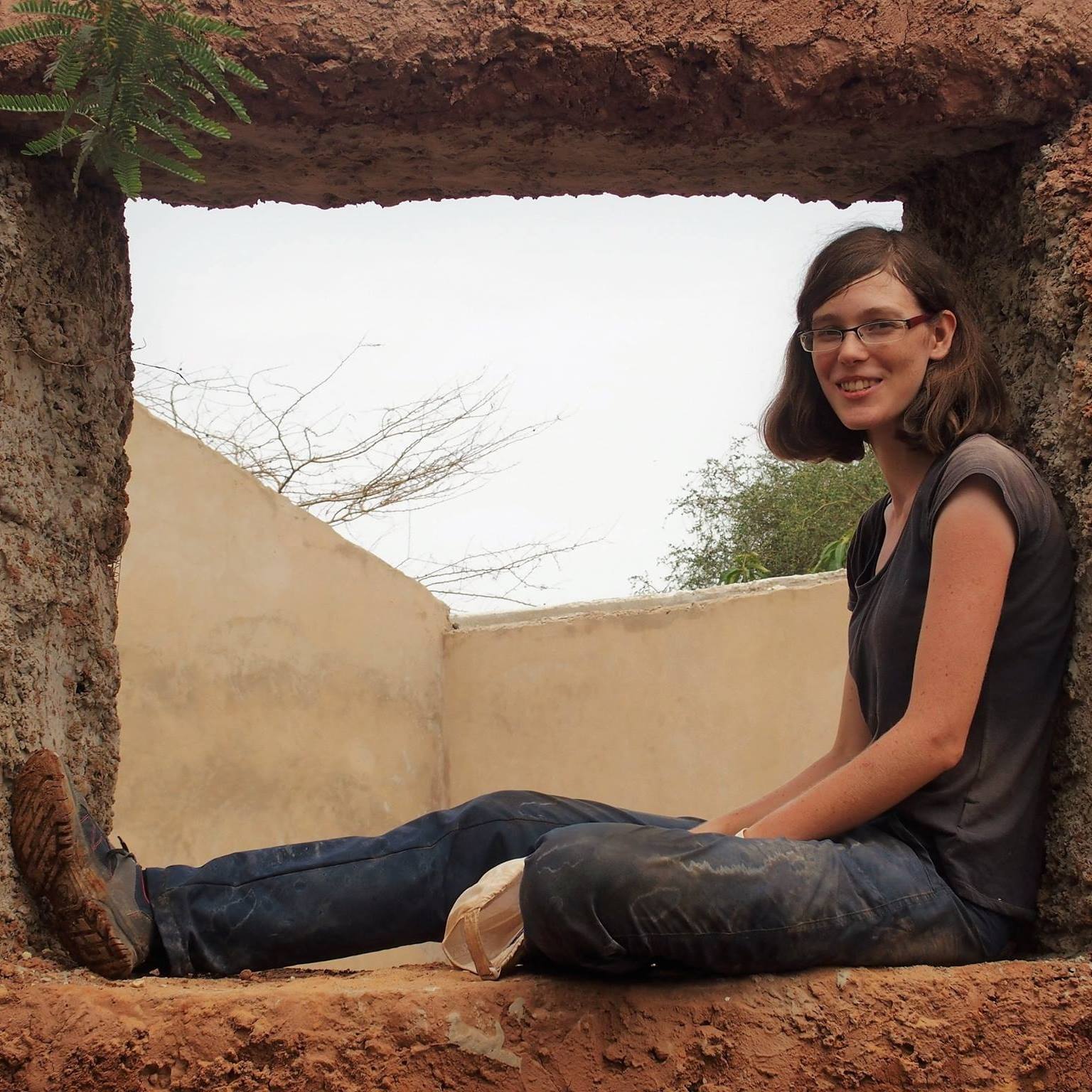 Taking a break on one of the classroom windows we had just finished building.